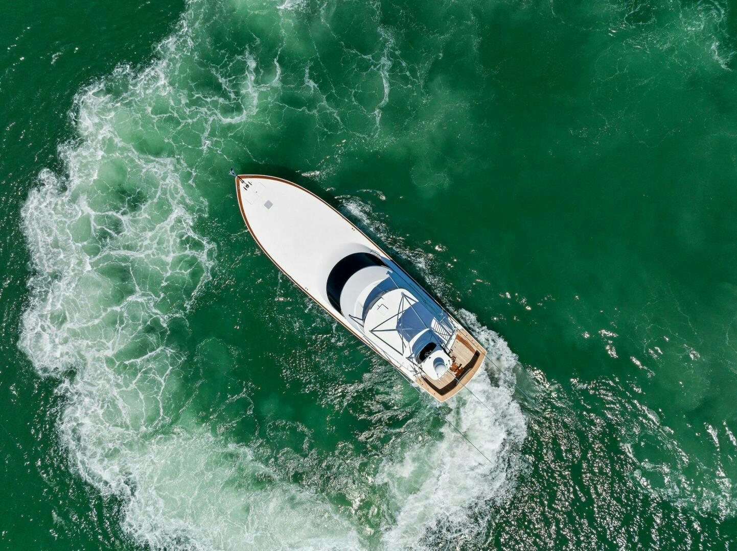a white surfboard on a wave aboard THE PROVIDER Yacht for Sale