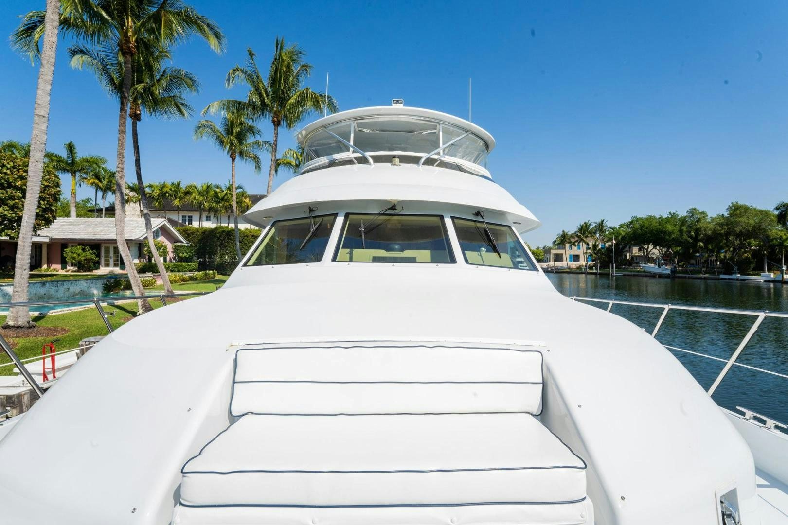 a white boat on a beach aboard CRISTINA Yacht for Sale