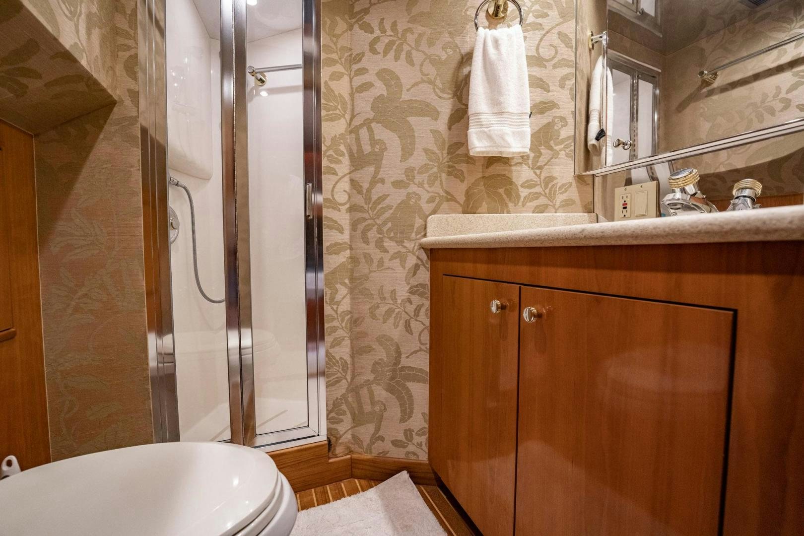 a bathroom with a shower and sink aboard CRISTINA Yacht for Sale