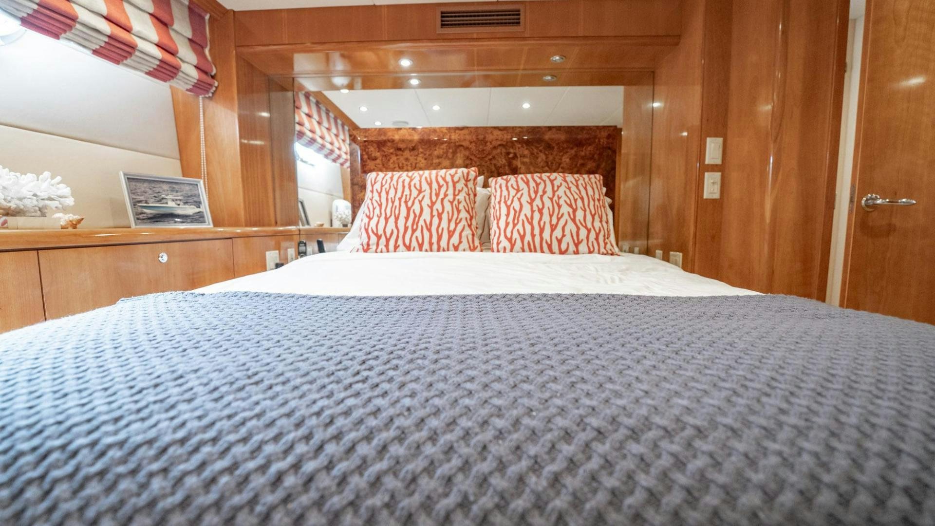 a bed with a white sheet aboard CRISTINA Yacht for Sale