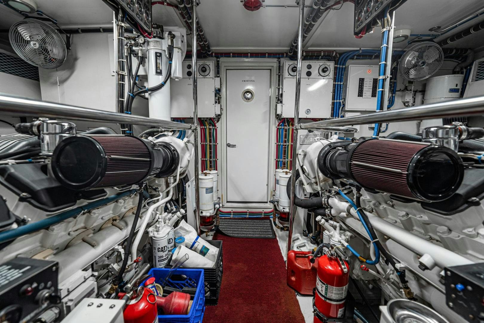 a room with machinery and pipes aboard CRISTINA Yacht for Sale