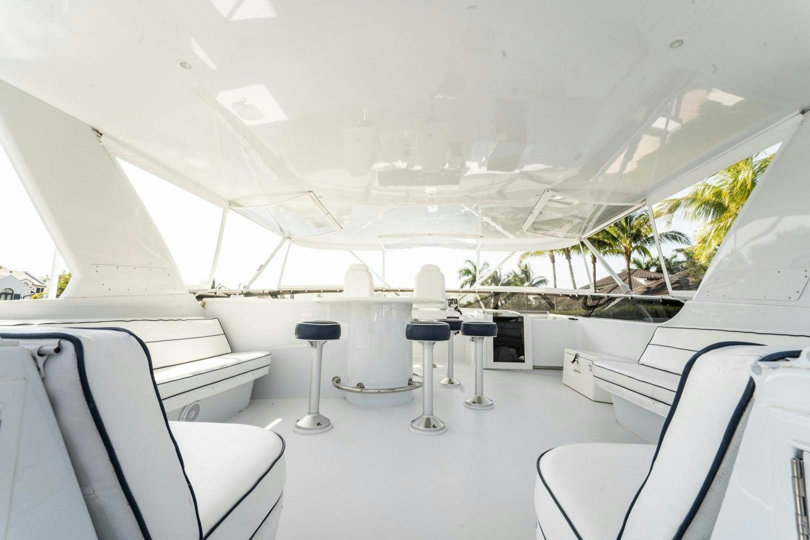 a room with chairs and tables aboard CRISTINA Yacht for Sale