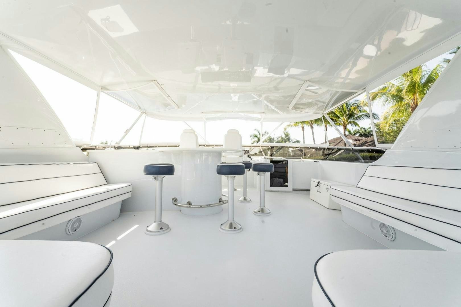 a room with a table and chairs aboard CRISTINA Yacht for Sale