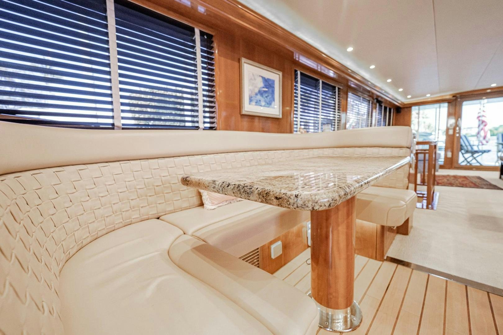 a room with a bed and a table aboard CRISTINA Yacht for Sale