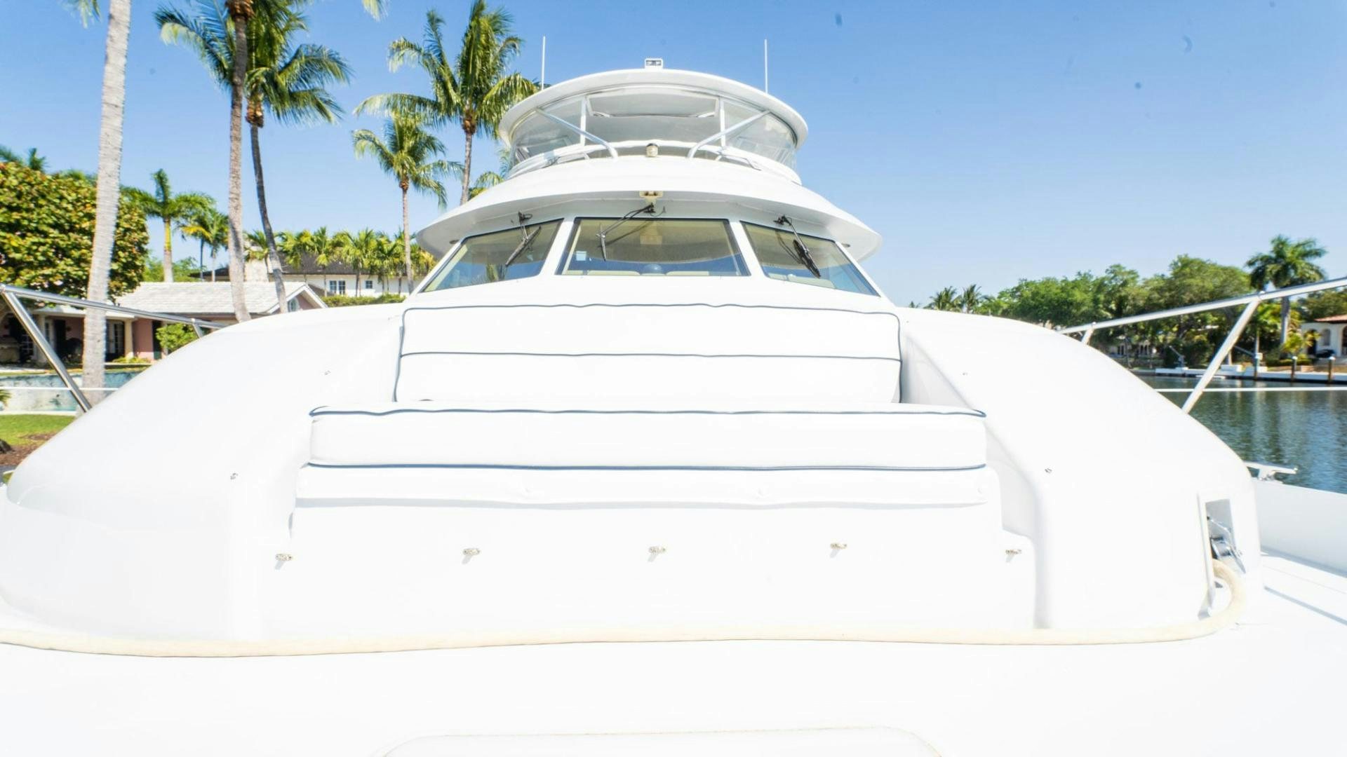 a white boat on a dock aboard CRISTINA Yacht for Sale