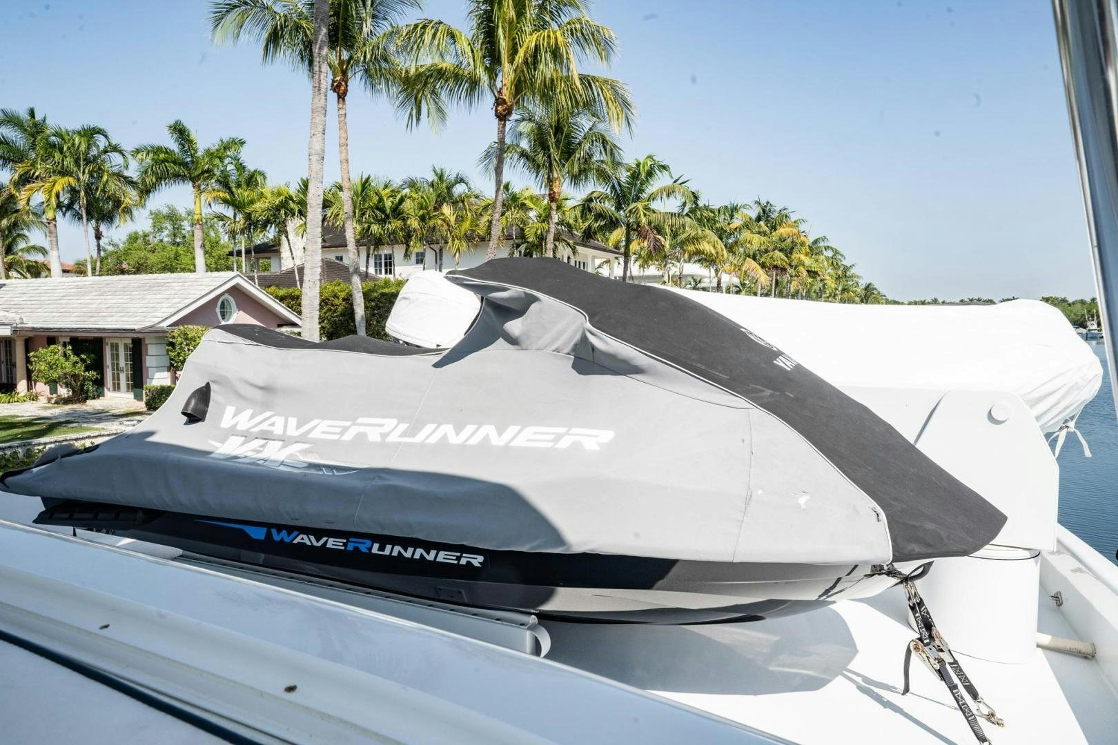 a white surfboard on a boat aboard CRISTINA Yacht for Sale