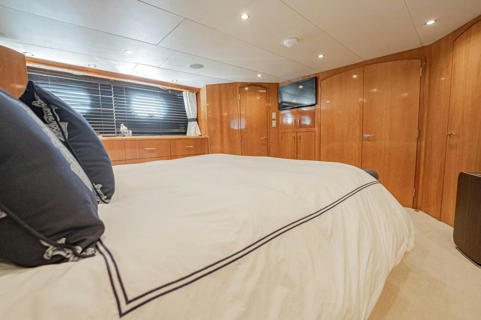 a bed in a room aboard CRISTINA Yacht for Sale
