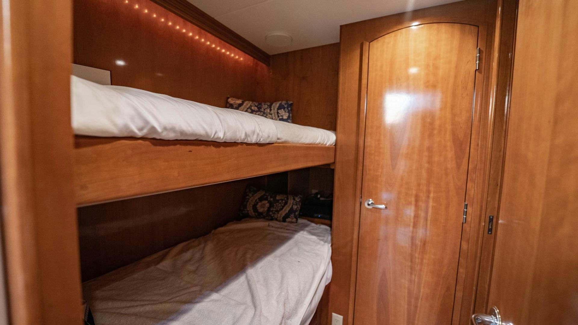 a room with two beds aboard CRISTINA Yacht for Sale