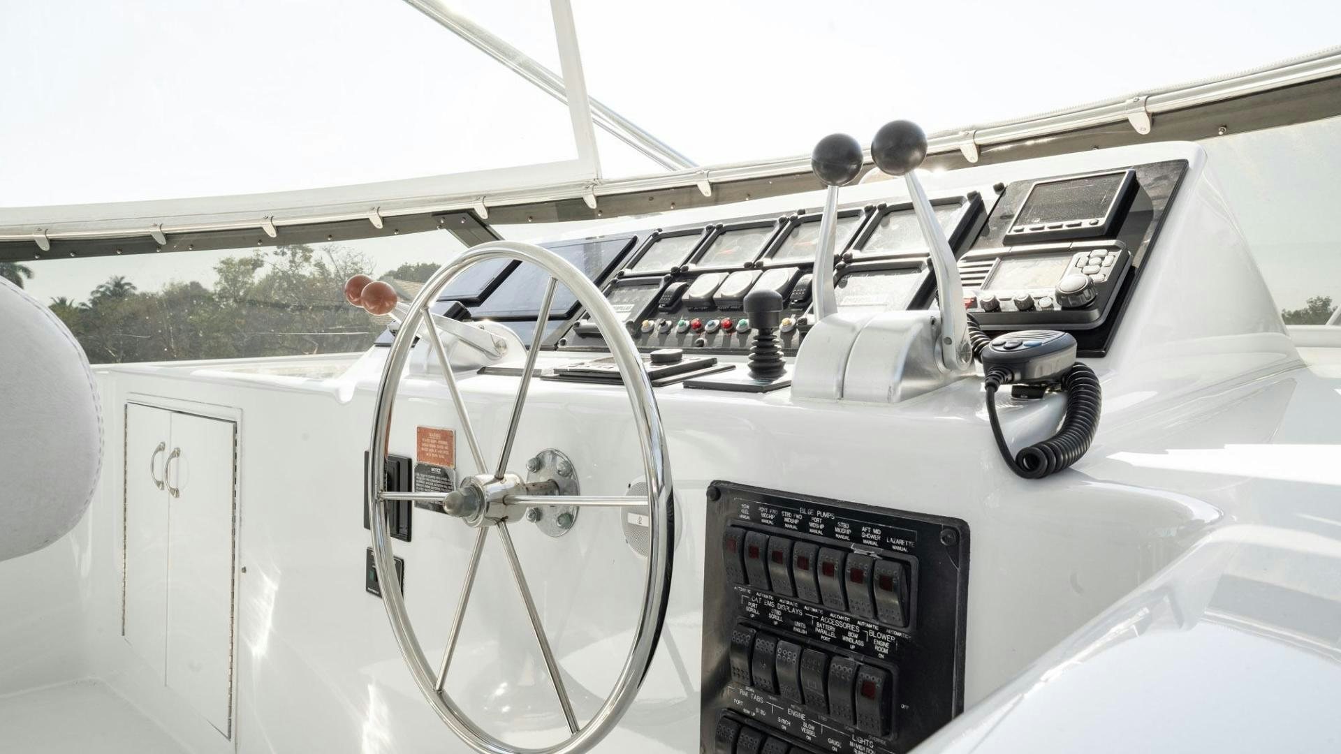 the interior of a white car aboard CRISTINA Yacht for Sale
