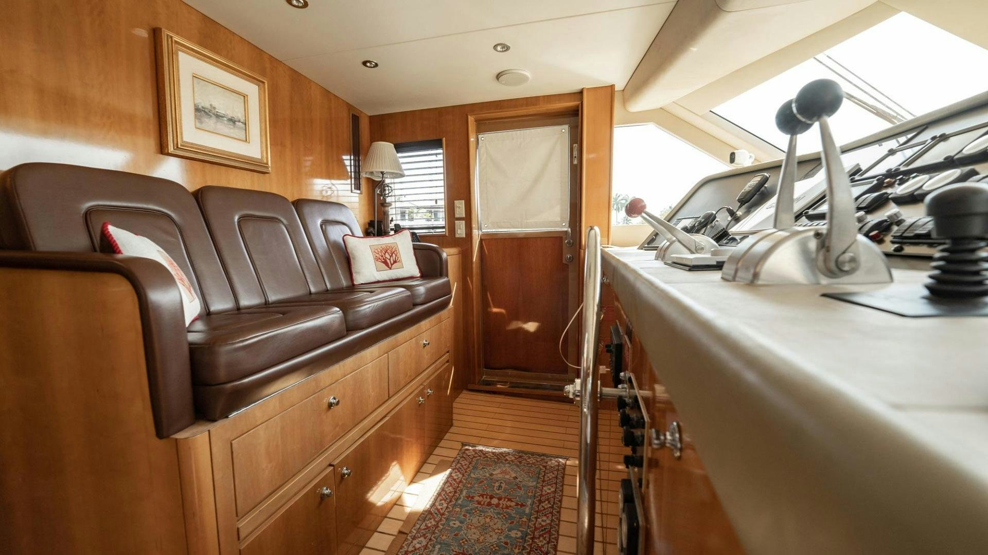 a room with a couch and a ladder aboard CRISTINA Yacht for Sale