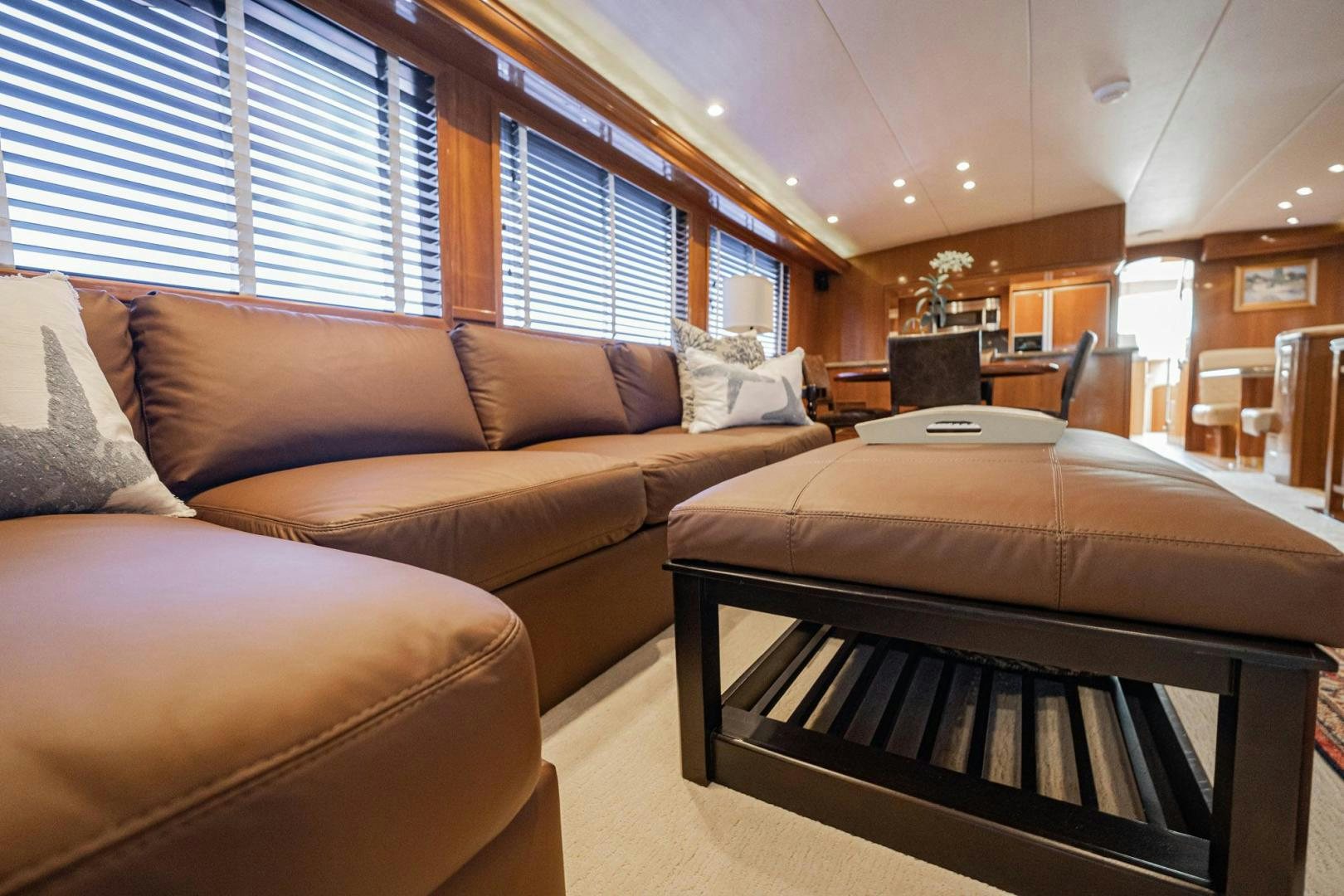 a bedroom with a bed and a couch aboard CRISTINA Yacht for Sale