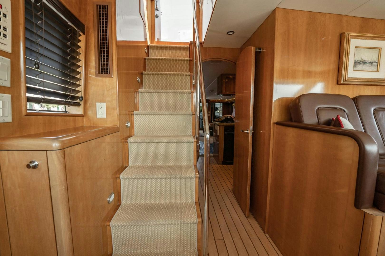 a room with a bed and a couch aboard CRISTINA Yacht for Sale