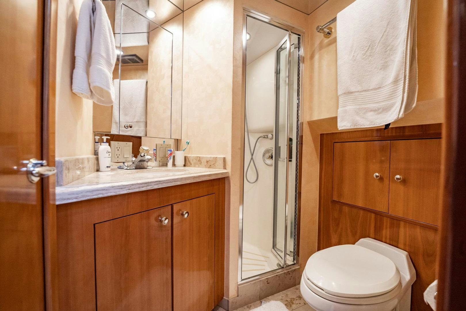 a bathroom with a sink toilet and a shower unit aboard CRISTINA Yacht for Sale