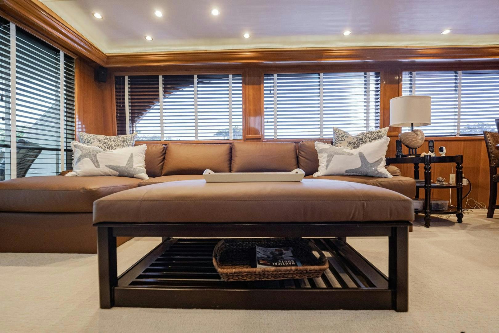 a couch in a living room aboard CRISTINA Yacht for Sale