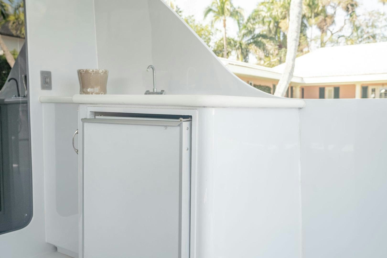 a white refrigerator in a kitchen aboard CRISTINA Yacht for Sale