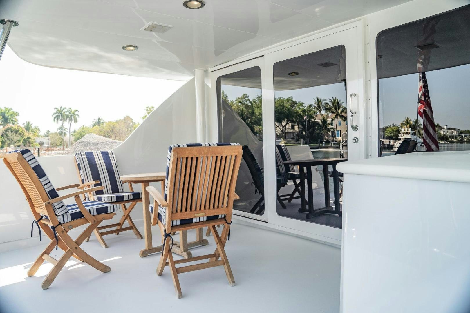 a room with chairs and tables aboard CRISTINA Yacht for Sale