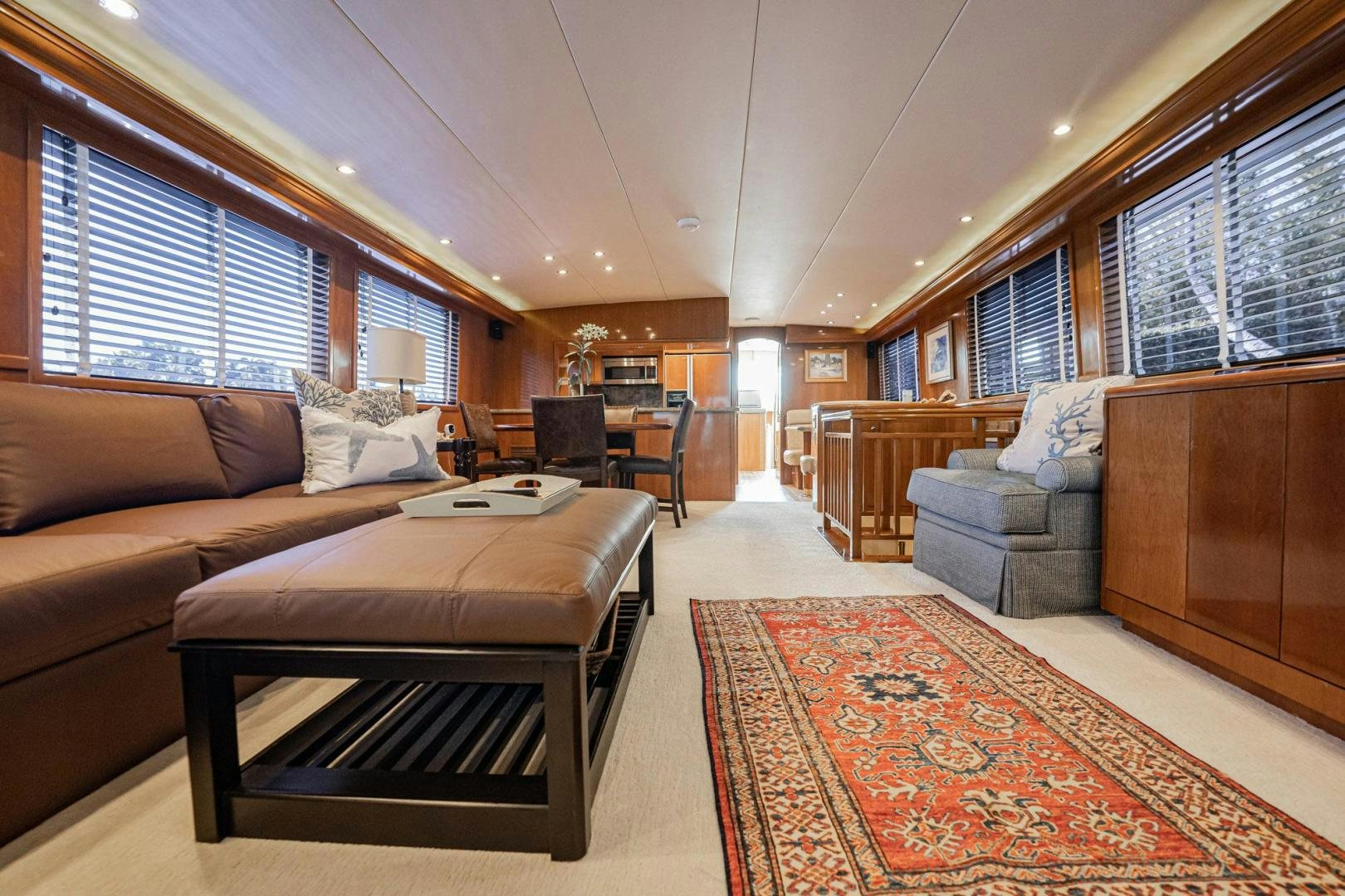 a living room with a couch and a table aboard CRISTINA Yacht for Sale