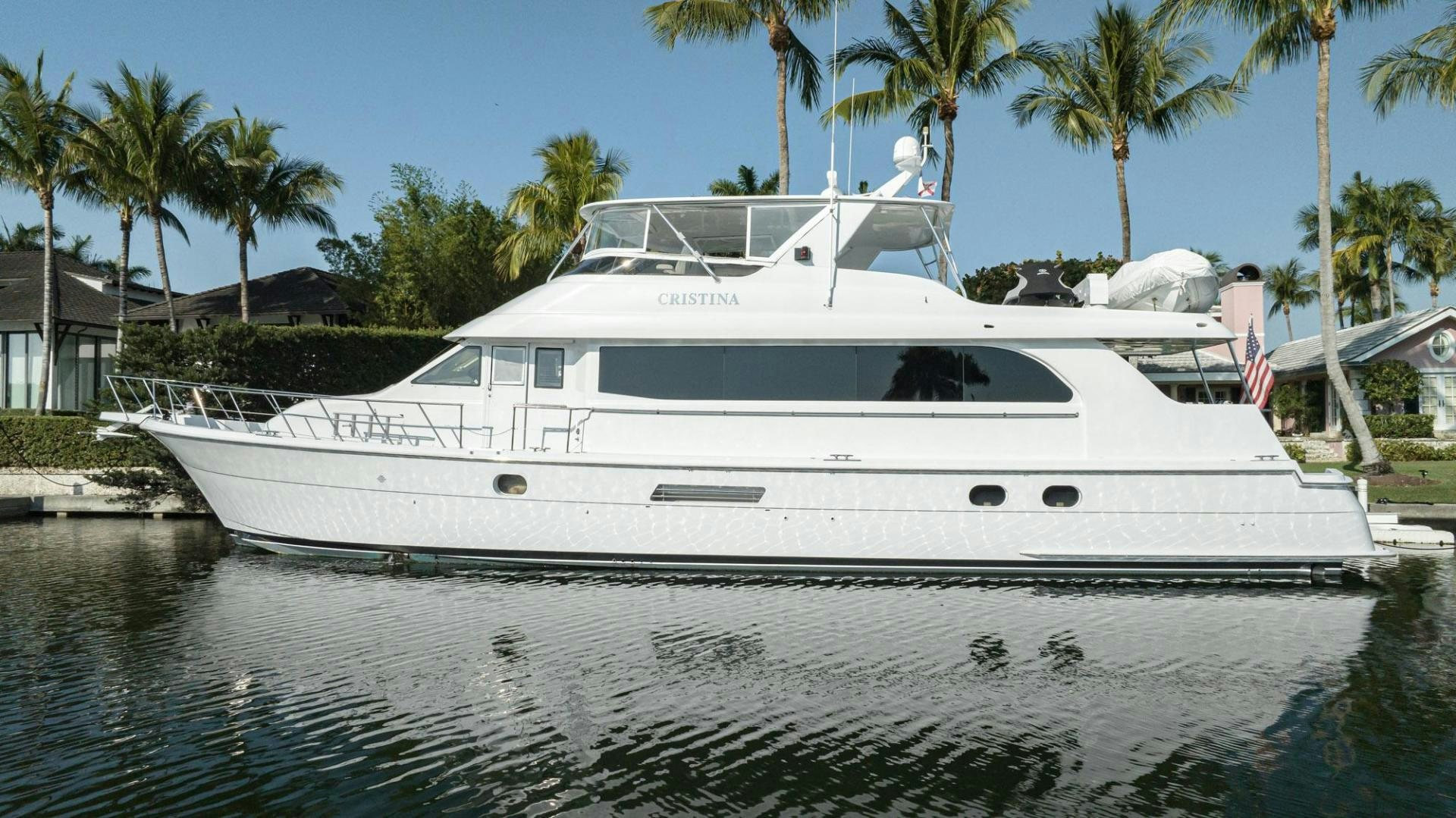 a white yacht on the water aboard CRISTINA Yacht for Sale