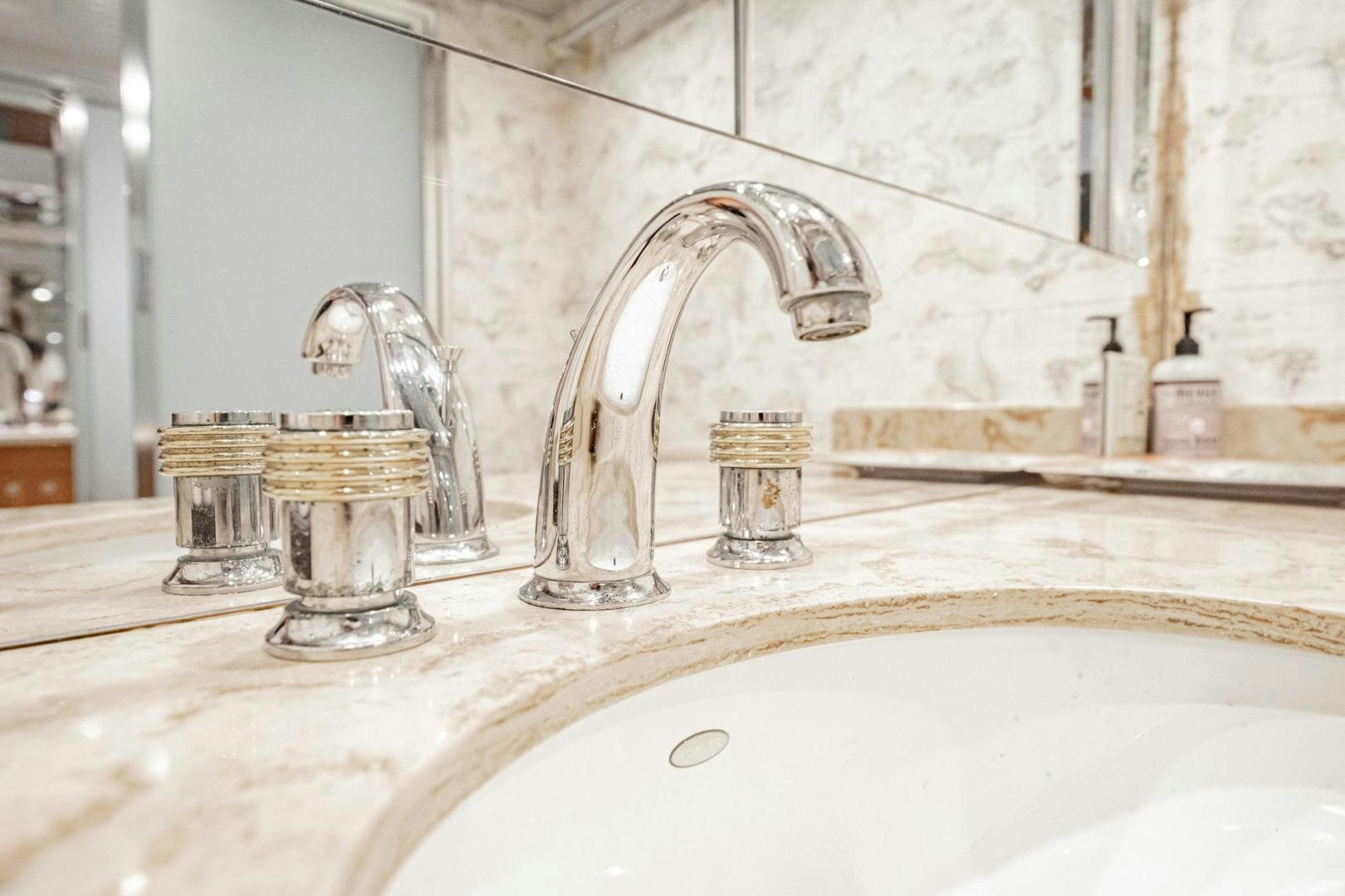 a bathroom sink with a faucet aboard CRISTINA Yacht for Sale