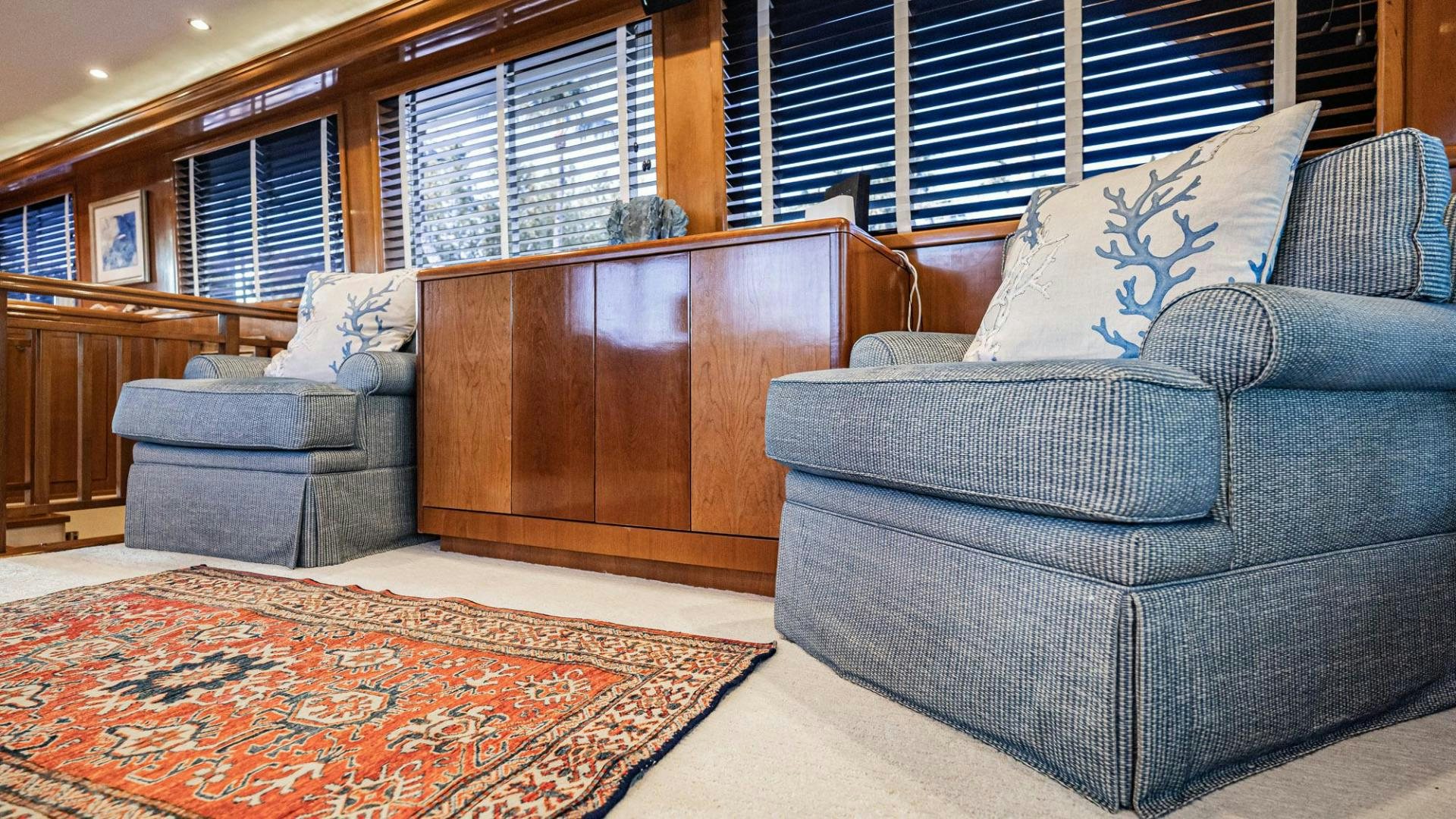 a room with a couch and a rug aboard CRISTINA Yacht for Sale