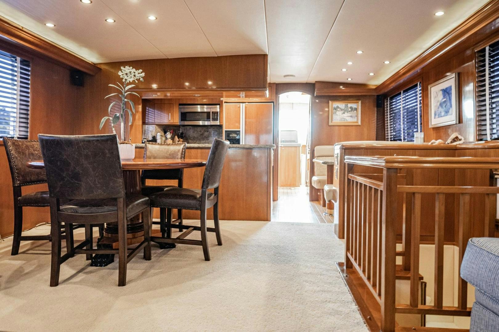 a dining room with a table and chairs aboard CRISTINA Yacht for Sale