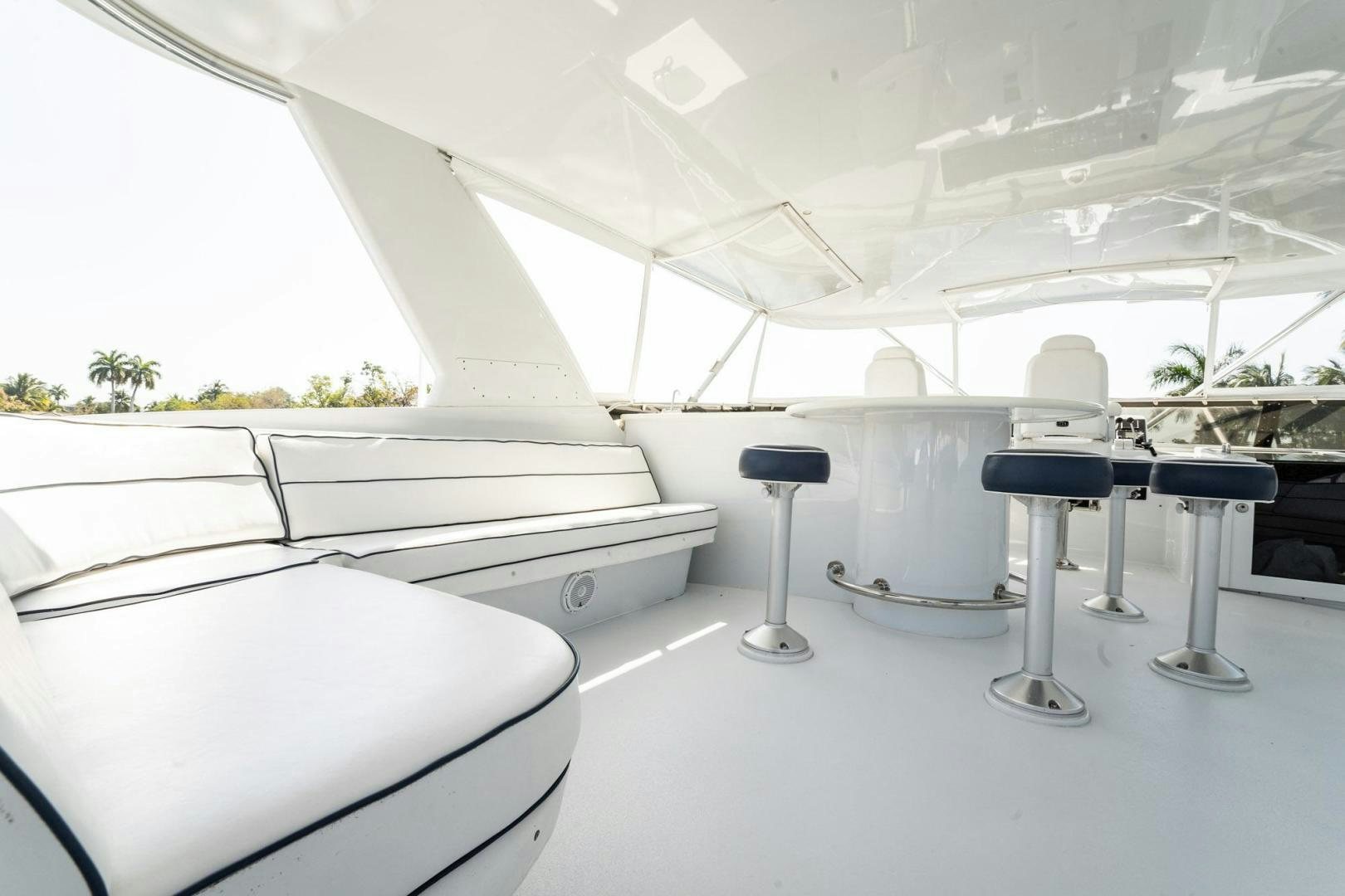 a room with a table and chairs aboard CRISTINA Yacht for Sale