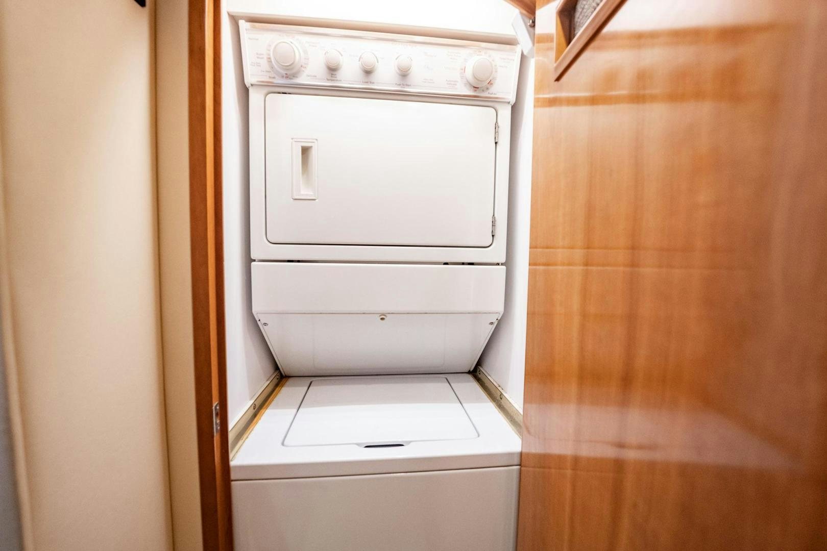 a white washing machine aboard CRISTINA Yacht for Sale
