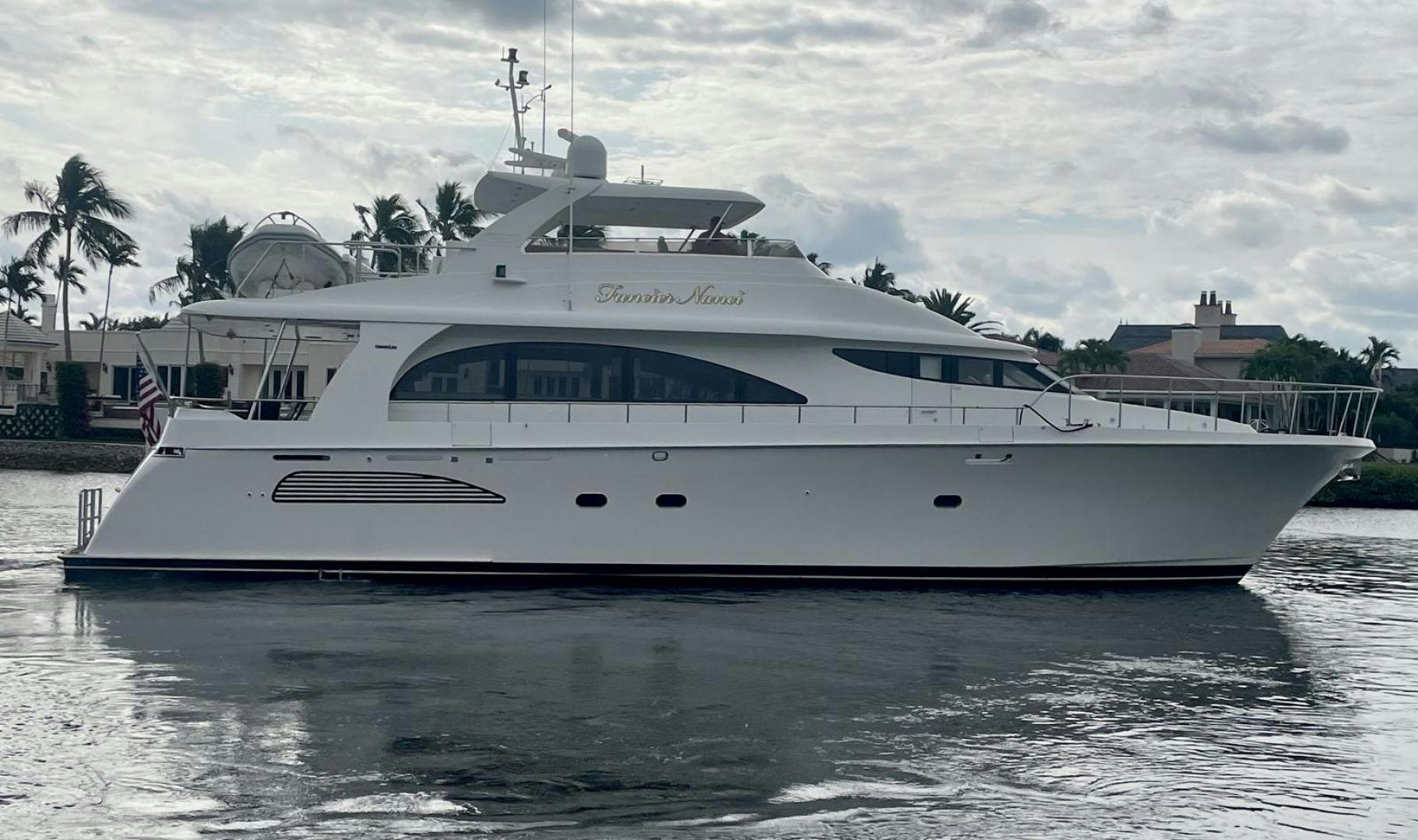 a white yacht in the water aboard FANCIER NANCI Yacht for Sale