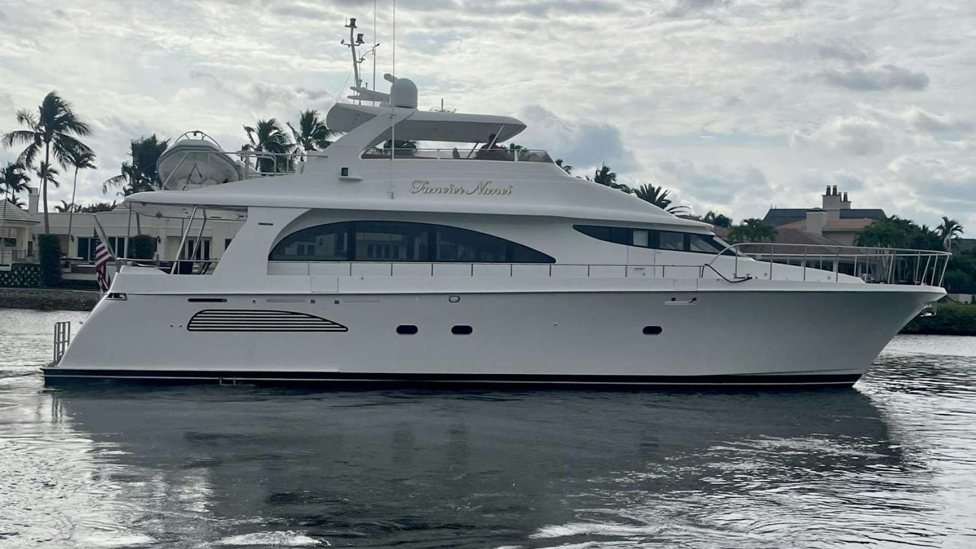 a white yacht in the water aboard FANCIER NANCI Yacht for Sale