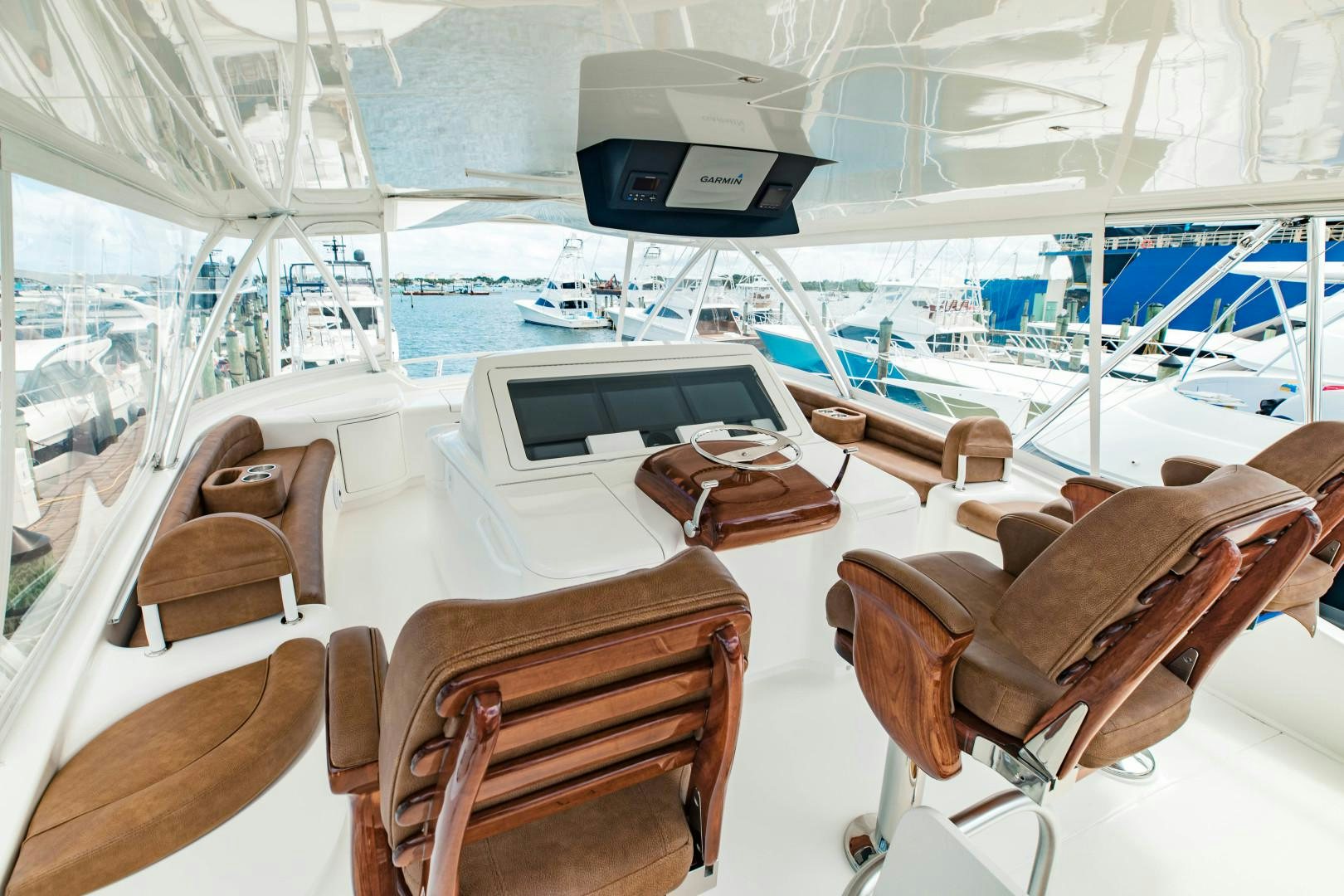 a room with a large white table and chairs and a large window aboard SHOE Yacht for Sale