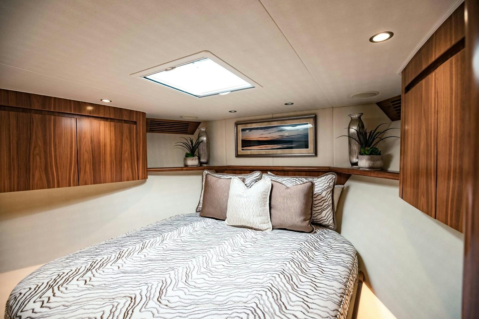 a bed with pillows aboard SHOE Yacht for Sale