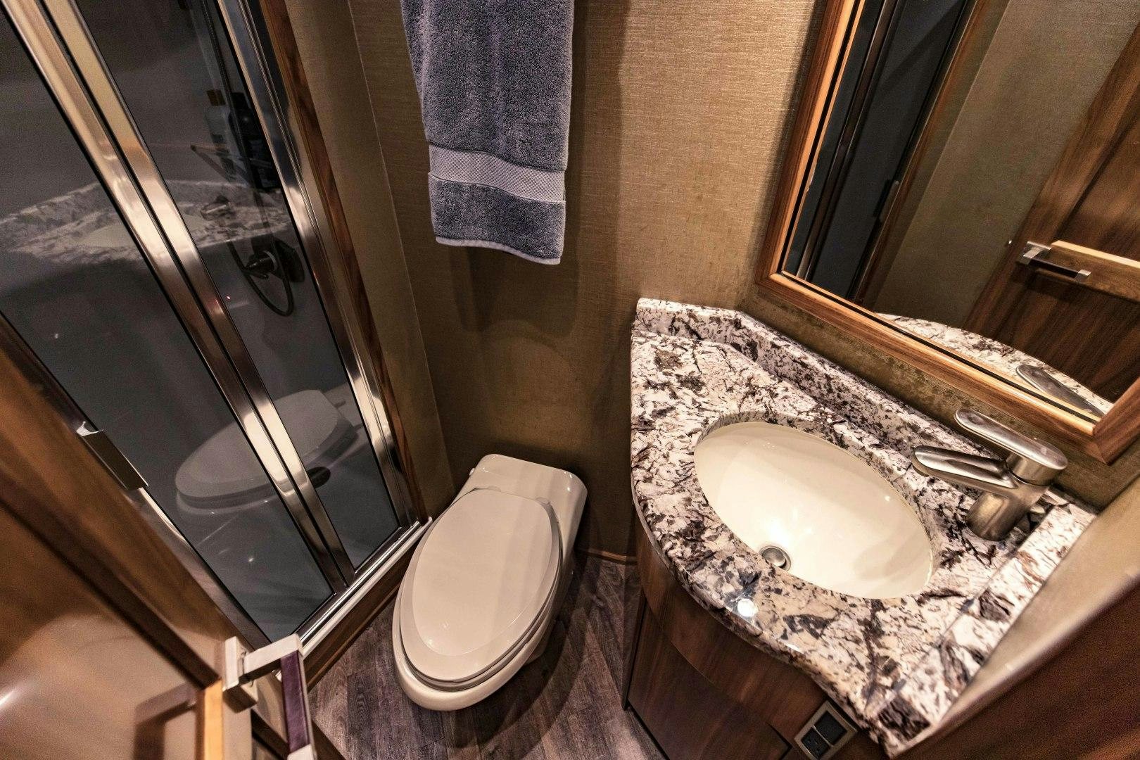 a bathroom with a sink and a toilet aboard SHOE Yacht for Sale