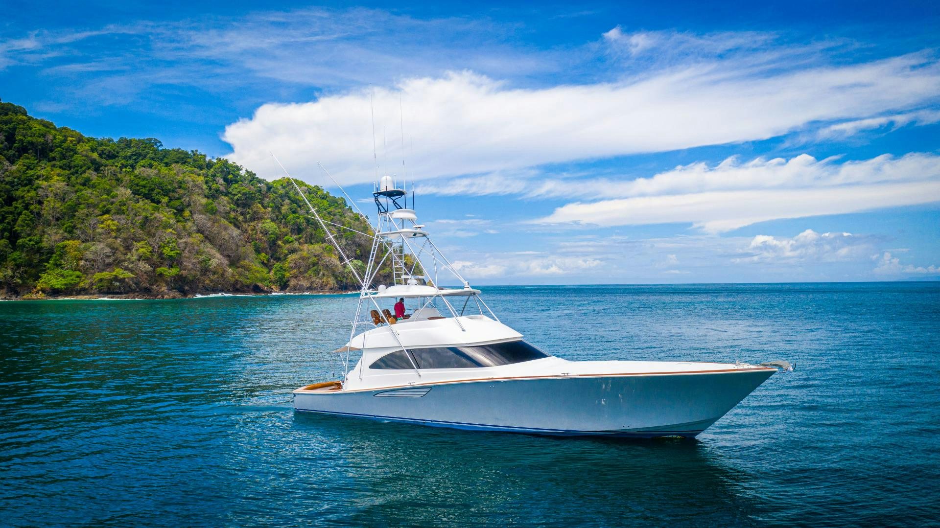 a white boat on the water aboard SHOE Yacht for Sale