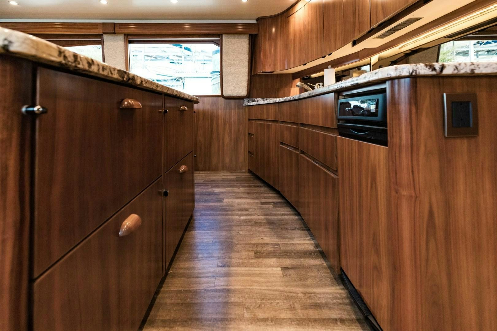 a wood cabinet in a room aboard SHOE Yacht for Sale