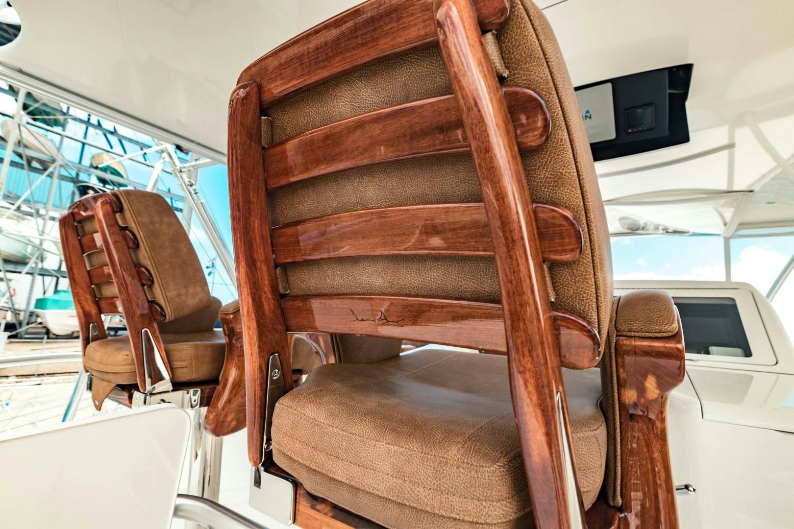 a brown leather chair aboard SHOE Yacht for Sale