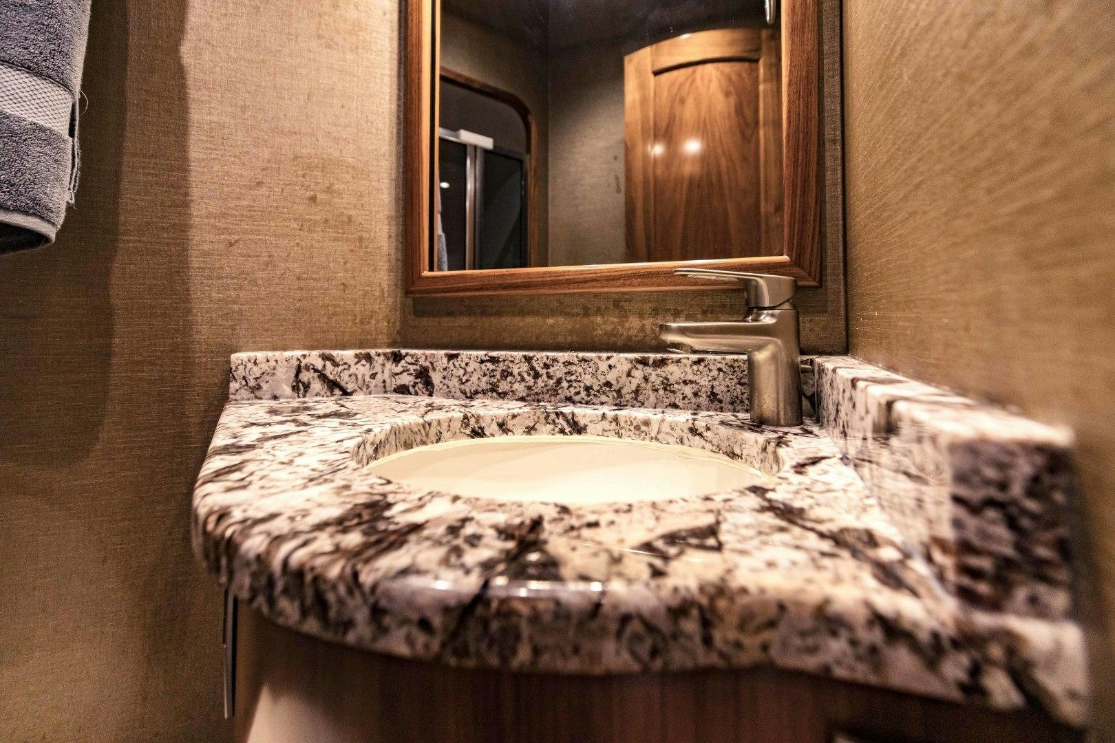 a bathroom with a marble counter top aboard SHOE Yacht for Sale