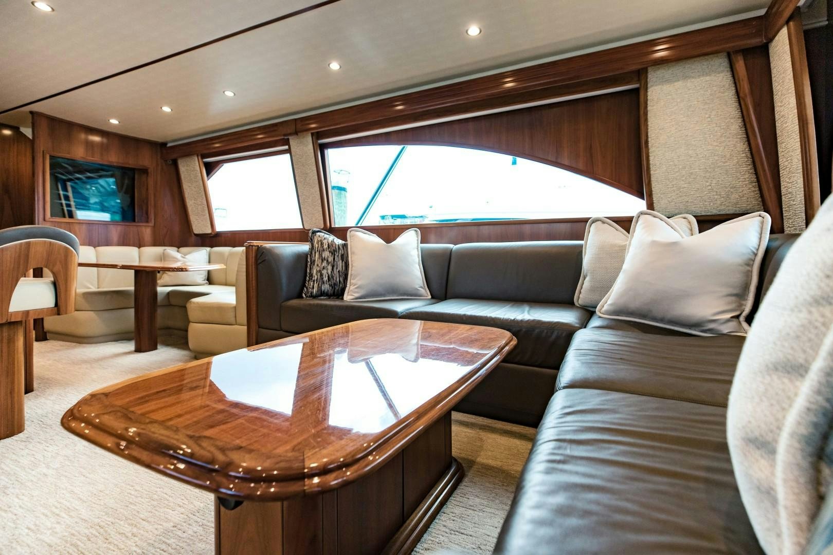 a living room with a couch and a table aboard SHOE Yacht for Sale