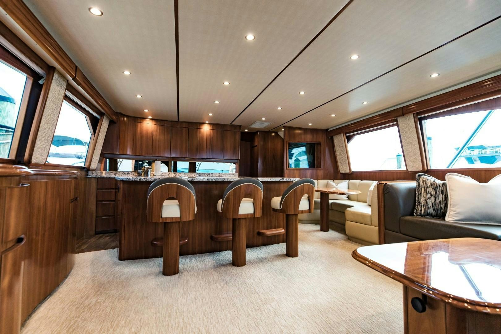 a room with a couch and a table and chairs aboard SHOE Yacht for Sale