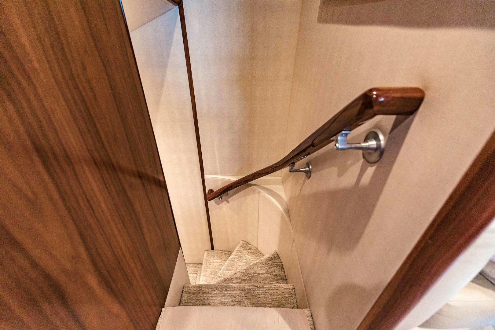 a bathroom with a wood door aboard SHOE Yacht for Sale