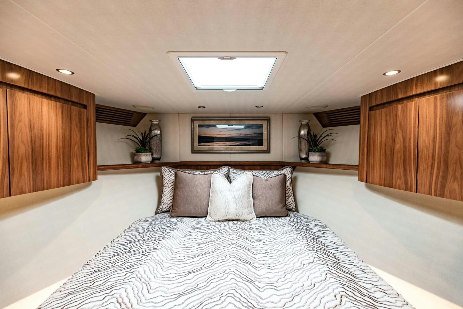 a bed with pillows aboard SHOE Yacht for Sale
