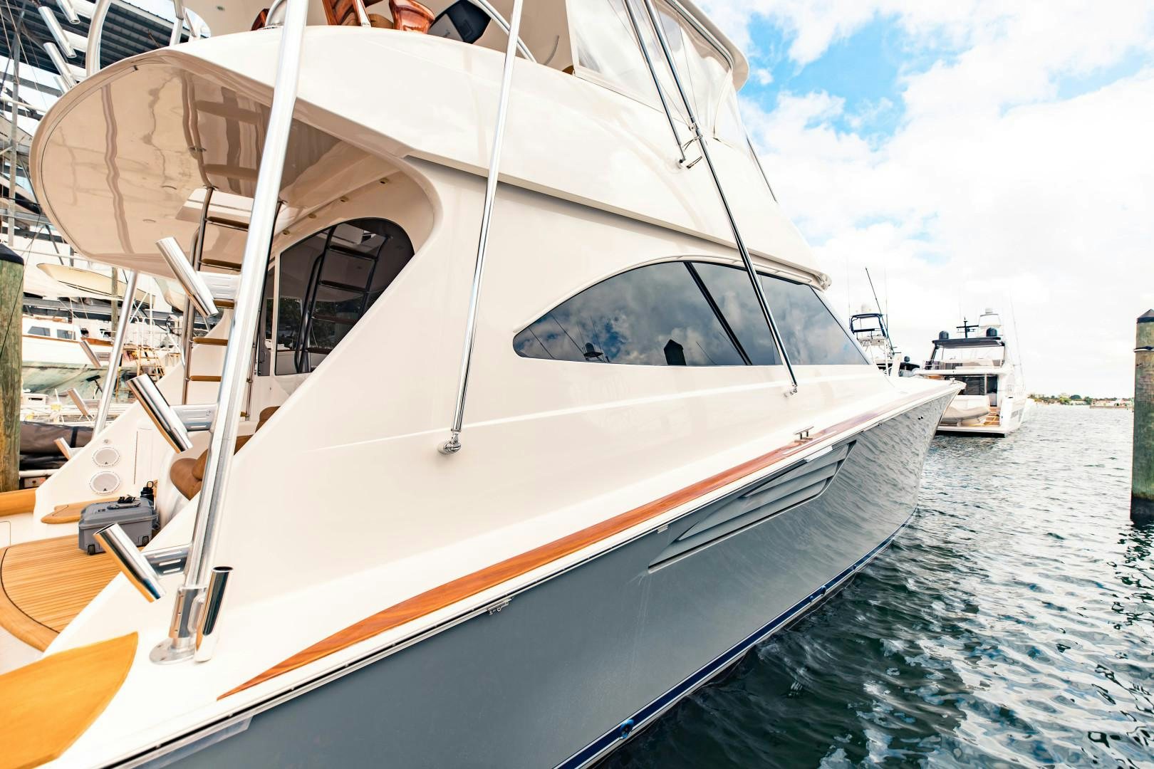 a white boat on the water aboard SHOE Yacht for Sale