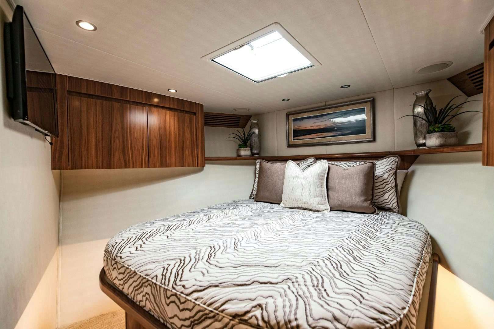 a bed with pillows aboard SHOE Yacht for Sale