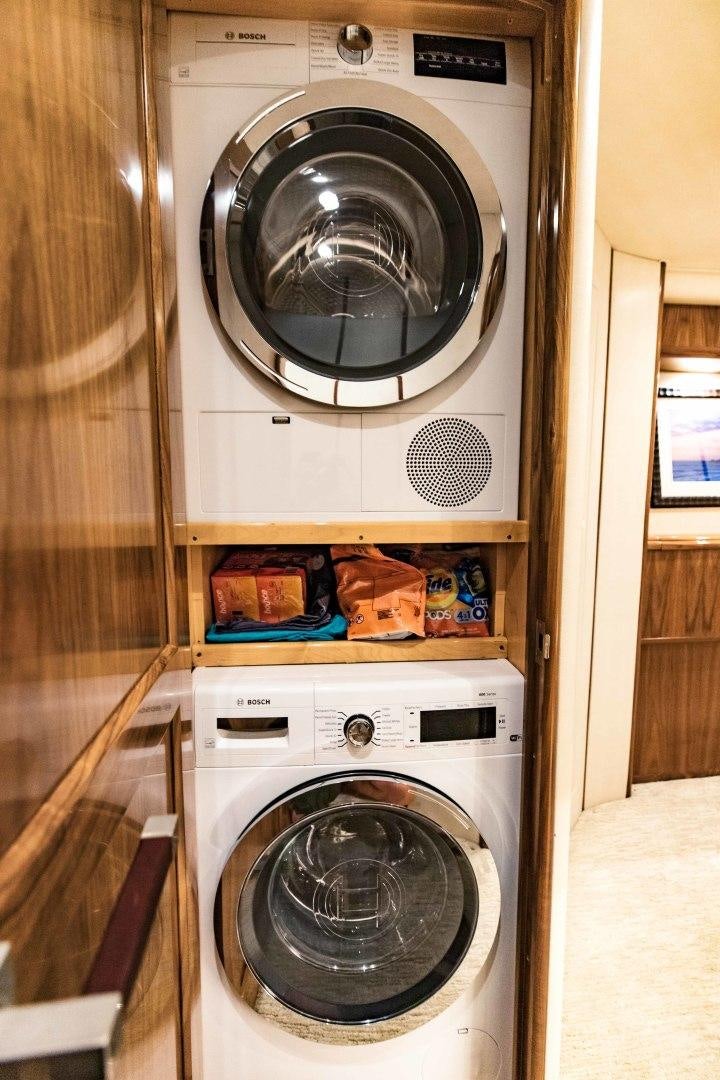 a washer and dryer in a room aboard SHOE Yacht for Sale