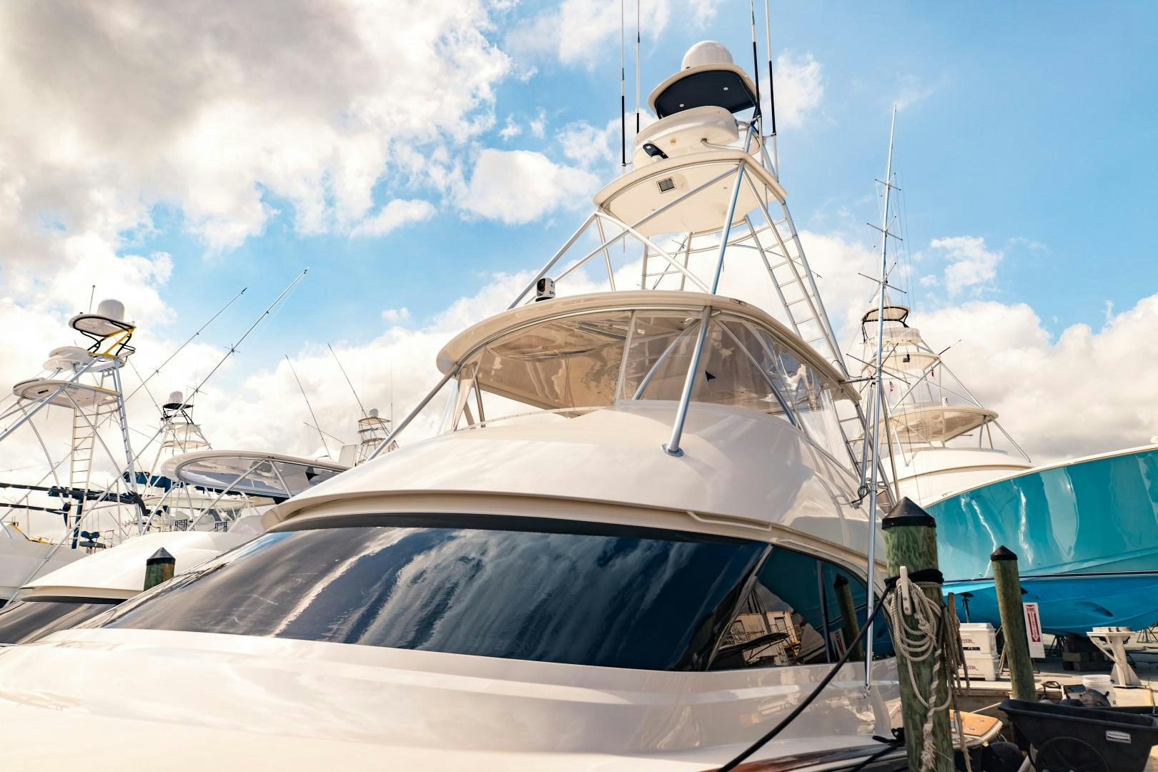 a white boat with a black hat on it aboard SHOE Yacht for Sale