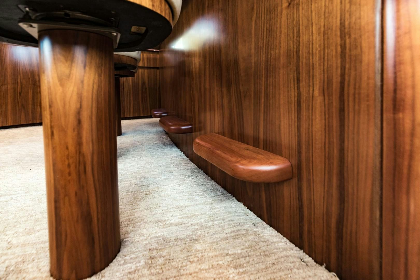a wooden chair in a room aboard SHOE Yacht for Sale