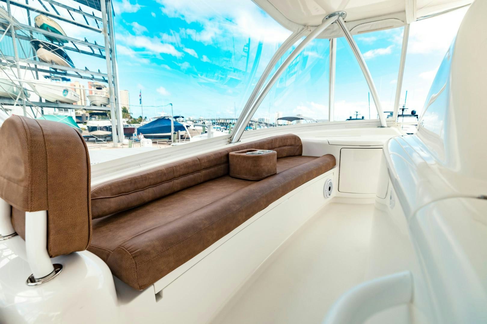 a room with a view of the water and a boat aboard SHOE Yacht for Sale
