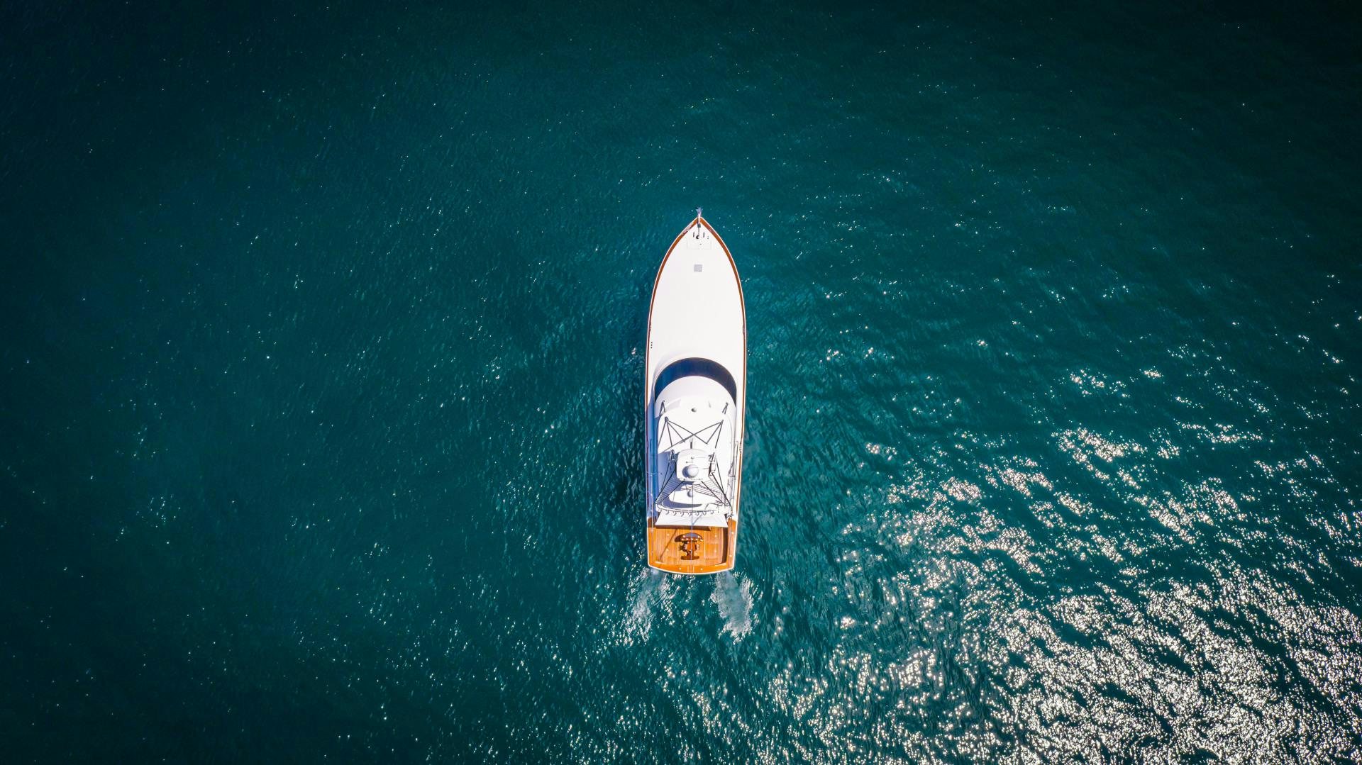 a rocket flying over earth aboard SHOE Yacht for Sale