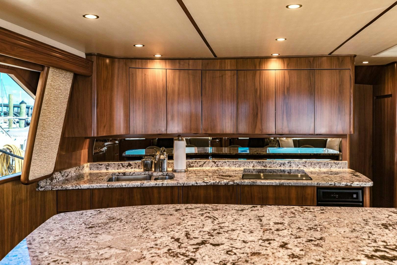 a kitchen with marble counters aboard SHOE Yacht for Sale