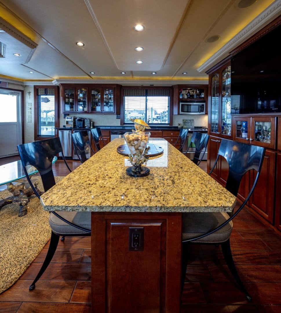 a large dining table in a large room aboard KNOT TIDE DOWN Yacht for Sale