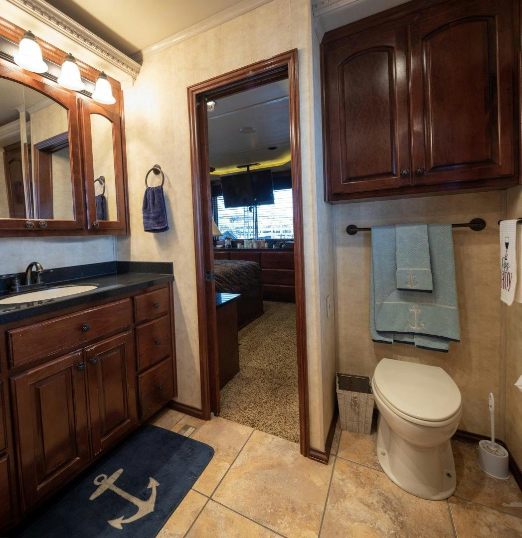 a bathroom with a toilet and sink aboard KNOT TIDE DOWN Yacht for Sale
